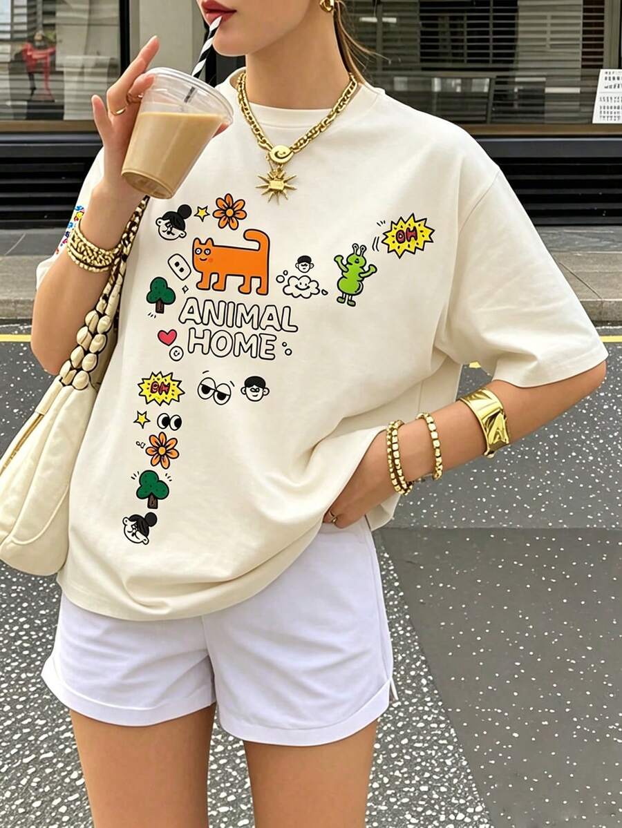 卡通塗鴉「動物之家」圖案 T 恤，可愛橘貓與外星人印花 T 恤，俏皮活潑氛圍夏季休閒上衣