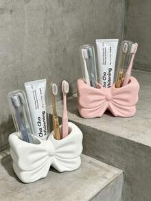 1pc Cute Bow-Shaped Toothbrush Holder, White & Pink Toothpaste Storage Rack, Bathroom Storage Shelf, Vanity Countertop Organizer, Home Bathroom Decor Accessory - Multicolor - View 2