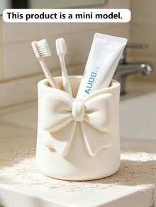1pc Mini Cream Bow Creative Fun Toothbrush Holder, Toothbrush Cup, Desktop Organizer, Can Hold Toothbrush, Toothpaste, Flower Pot, Vase, Dressing Table Decor, Bathroom Supplies. Warm Home Bathroom Decor Autumn Decor Back To School Season - Multicolor - View 2