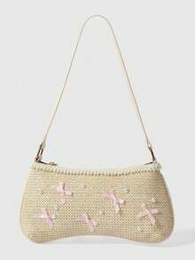 Bolso de paja con lazo rosa