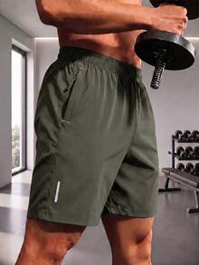 Pantalones cortos deportivos casuales holgados de alto rendimiento para hombre, de secado rápido, unicolor, con diseño de franja reflectante, bolsillos, cremallera y cordón en la cintura - Verde Oscuro - Ver 1