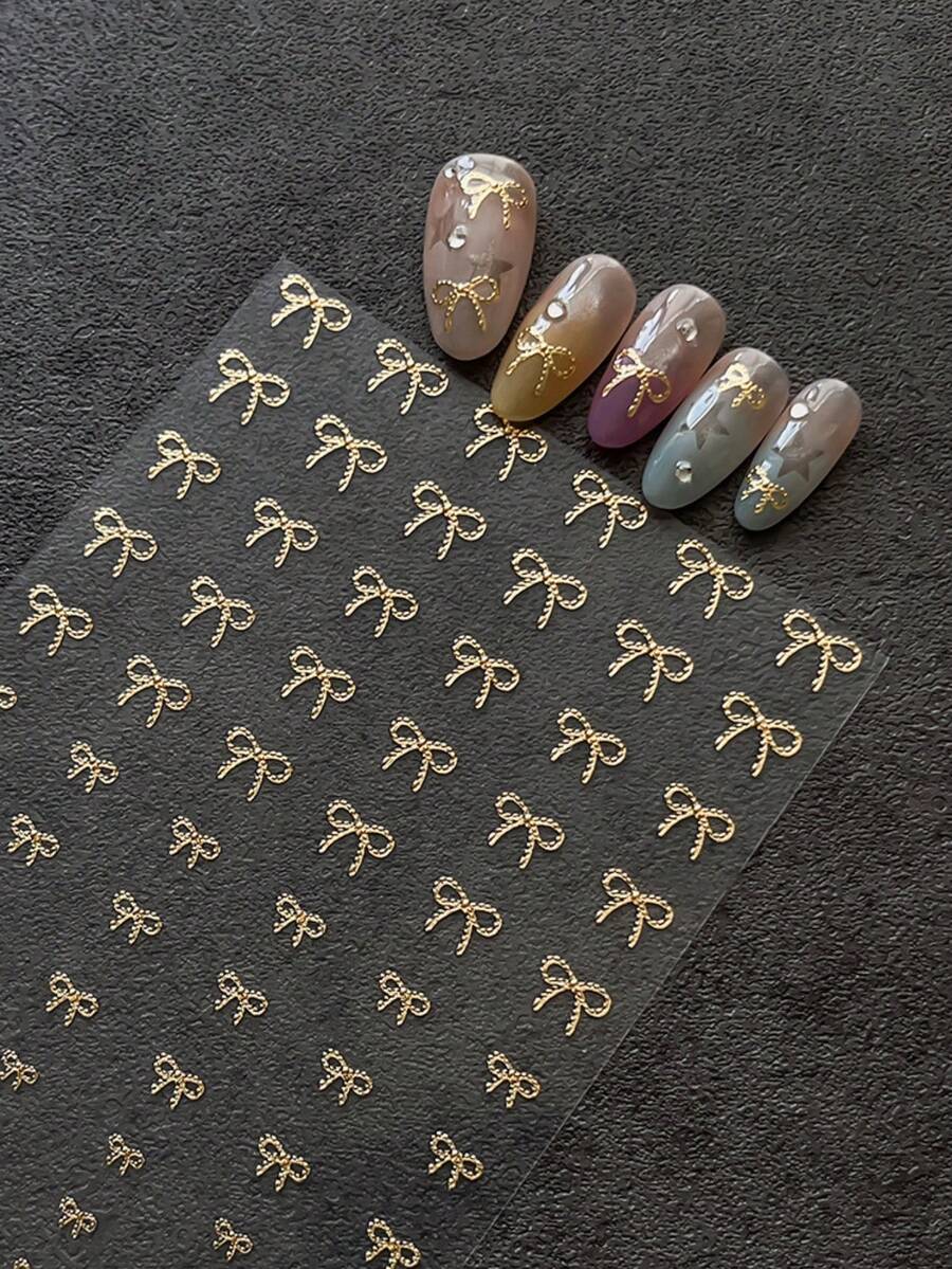 1 Sheet Gold Foil Bow Nail Stickers, 3D Embossed Multi-Size Gold Ribbon Bow Pattern, Self-Adhesive Nail Art Supplies For French & Bridal Style - Gold - View 1
