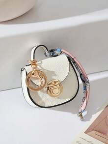 CHARM INFINITE Bolso colgante multifuncional con llavero de cierre giratorio mini en forma de silla de montar, textura de lichi en 7 colores, decoración de cinta de seda estampada, para guardar auriculares, lápiz labial y monedas - Multicolor - Ver 18