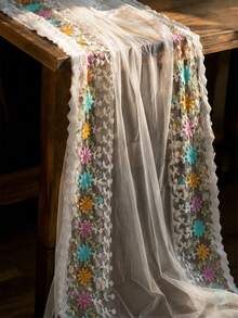 白色透明薄紗刺繡布料－鮮豔多色雛菊蕾絲飾邊，附鋸齒邊緣與綠葉藤蔓針繡－50cm、1碼、3碼或5碼－適合波希米亞風派對洋裝、婚紗面紗、桌旗與手工髮飾 - 1 - 查看 1