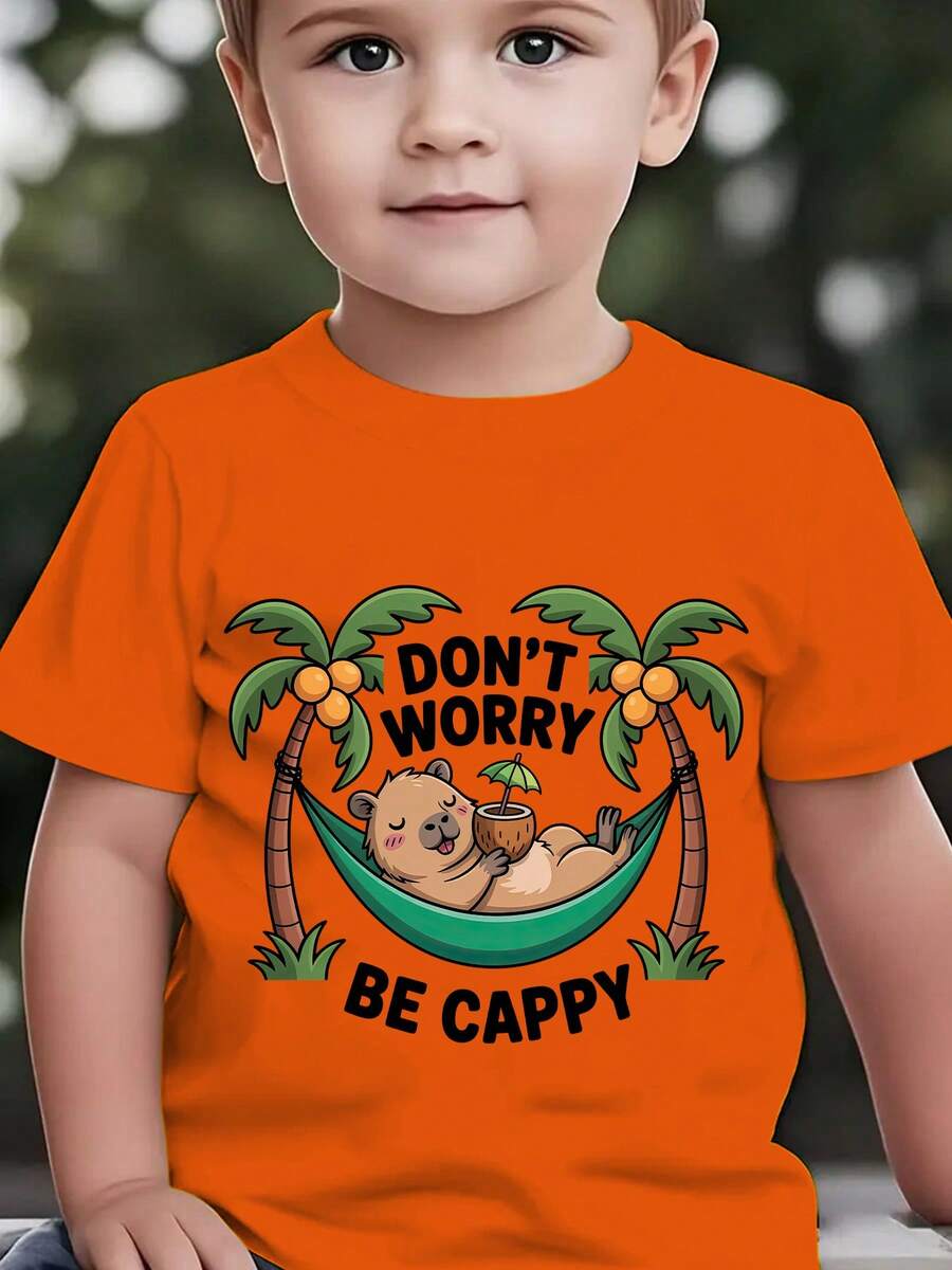 Fashionable Short-Sleeved T-Shirt For Children In Summer With The Print "DON'T WORRY BE CAPPY" And A Cartoon Capybara Lying In A Green Hammock Among Coconut Trees, Casual Top For E - 酒紅色 - 查看 1