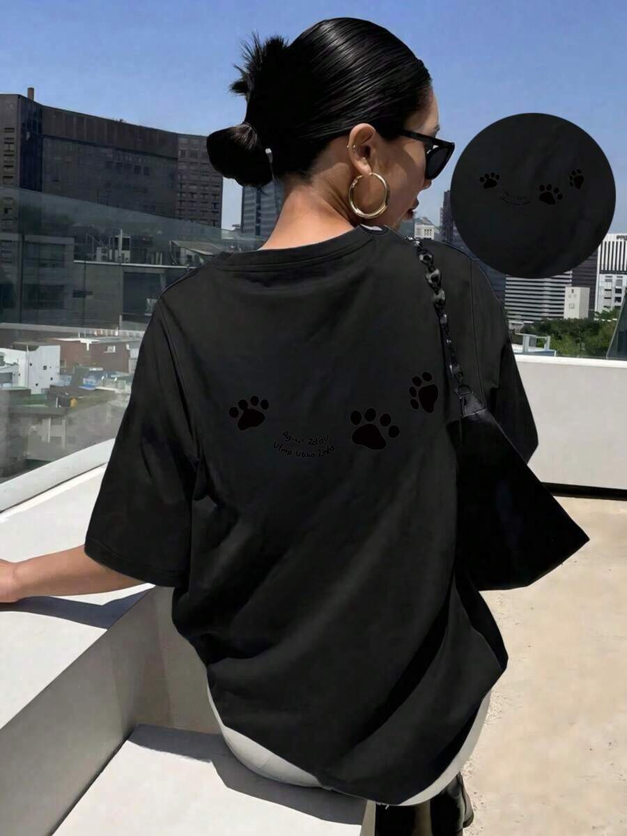 Spring And Summer Collection With A Short Sleeve Round Neck T-Shirt Decorated With An Adorable Paw Print Design On The Back, Perfect For Casual And Versatile Use. - Black - View 1