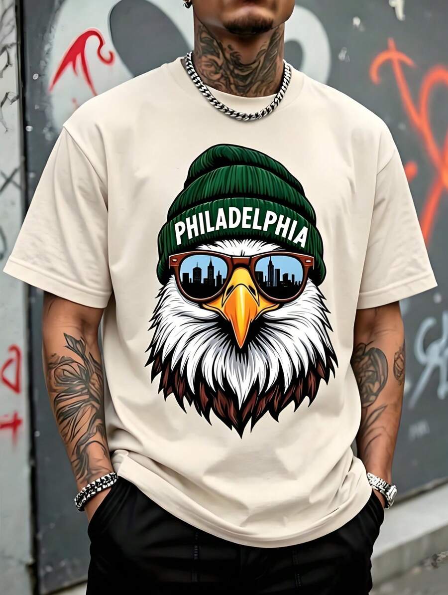 Camiseta de hombre Holgada, Estampado Águila Calva con Gorro de Lana Verde "Filadelfia" y Gafas con Silueta de Ciudad,Playera Manga Corta Estilo Urbano Americano Streetwear.