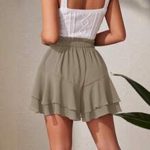 Falda pantalón de doble capa con volantes, cintura elástica y cordón ajustable: un diseño casual y deportivo pensado para evitar exposiciones accidentales. - Camel - Ver 4