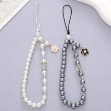2 Estilos Correa de Muñeca para Teléfono con Cuentas de Perlas Falsas y Flores, Elegante Cordón para Teléfono con Cristales de Strass, Decoración para Bolso, Llave y Auriculares para Mujeres y Niñas - Pulsera de perlas y camelias - Ver 1