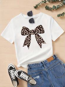 Camiseta con estampado de dibujos animados y lazo con estampado de leopardo, camiseta de manga corta con cuello redondo para niñas, ropa de verano para niñas, adecuada para edades de 8 a 14 - Blanco - Ver 1
