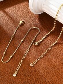 Juego de 2 piezas de tobilleras doradas apilables elegantes, estilo minimalista, adecuadas como accesorios de joyería para los pies de uso diario para mujeres - Dorado - Ver 4
