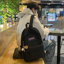 A Unisex, Plain, Large-Capacity Backpack For High School Students. It Features A Simple And Versatile Design With Multiple Pockets. - Black - View 2