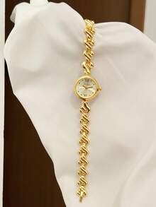 Jam tangan wanita yang elegan dan klasik ini menampilkan desain oval, pengerjaan yang indah, dan gaya yang unik. - Emas - View 7