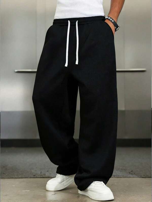 1 par de pantalones de chándal holgados y casuales para hombres, diseño de pierna ancha de unicolor minimalista, cintura con cordón, bolsillos grandes, adecuado para uso diario, caminar, tra