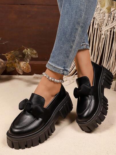 A Pair Of Classic Black Big Bow British College Style Thick Soled Height Increasing Women's Loafers, Suitable For Daily Commuting And Campus Parties