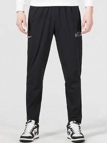 Celana olahraga kasual nyaman berbahan tenun dengan logo Nike polos dan bordir untuk pria. - Hitam - View 1