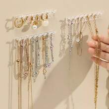 3 piezas Mini estante de exhibición de joyas, estante adhesivo multifuncional sin taladro para anillos y collares, estante de almacenamiento de collares para la parte trasera de la puerta del armario con espejo, ganchos colgantes para pulseras y aretes anti-enredos, estante de exhibición de joyas montado en la pared, estante de joyas para decoración del hogar - transparente - Ver 6