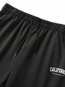 Pantalones de chándal ligeros y sueltos con cordón elástico para hombres, estampado con letras de moda - Negro - Ver 1