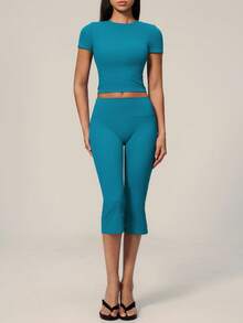 TimeOff Conjunto deportivo de mujer de un solo color con cuello redondo, manga corta, pantalones acampanados de largo medio - Agua verde azul - Ver 5