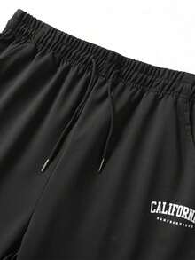 Pantalones de chándal ligeros y sueltos con cordón elástico para hombres, estampado con letras de moda - verde hierba - Ver 1