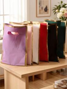 Nuevas bolsas de regalo de plástico con borde dorado y asa plana de 4 dedos, gruesas y duraderas, opciones multicolor, gran resistencia y resistente a desgarros, textura mate premium, adecuadas para almacenamiento a granel y embalaje para tiendas de ropa, distribución de dulces y regalos para fiestas, almacenamiento de recuerdos festivos, compras diarias de artículos pequeños, buena capacidad de carga y no se rompen fácilmente, versátiles y reutilizables - multicolor - Ver 1