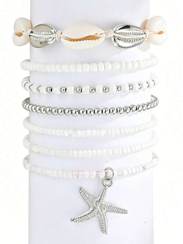 Conjunto de 7 pulseiras/tornozeleiras elásticas com estilo praiano, decoradas com conchas e estrelas-do-mar.
