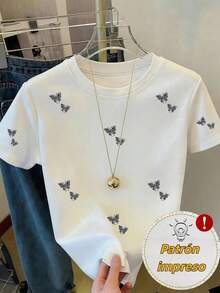 Camiseta de manga corta con cuello redondo para mujer, con un diseño delicado y dinámico en forma de mariposa rombo, que combina elegancia y comodidad para el uso diario. - Blanco - Ver 1
