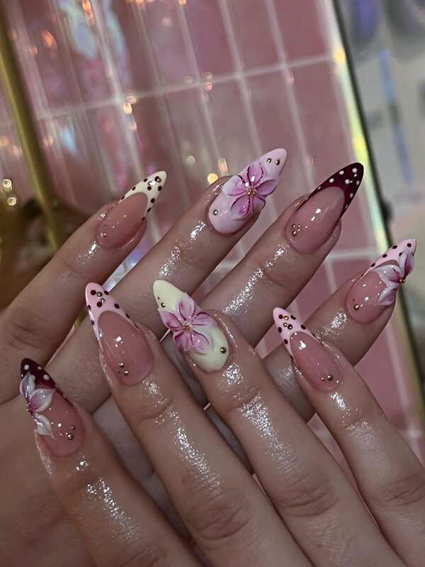 24 Pcs Almond Fake Nails Features A Polka-Dot French Tip Nails Design In Nude Pink And Burgundy. The Nails Have A Glossy, Lustrous Finish And Are Adorned With 3D Gradient Pink Cherry Blossoms And Gold Beads Press On Nails Almond