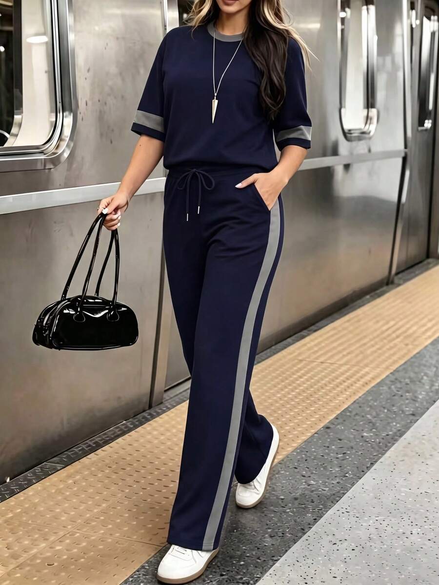 春夏女士两件套,休闲百搭撞色圆领短袖上衣搭配高腰抽绳直筒裤,尽显优雅气质。 - 藏青+灰色 - 查看 1