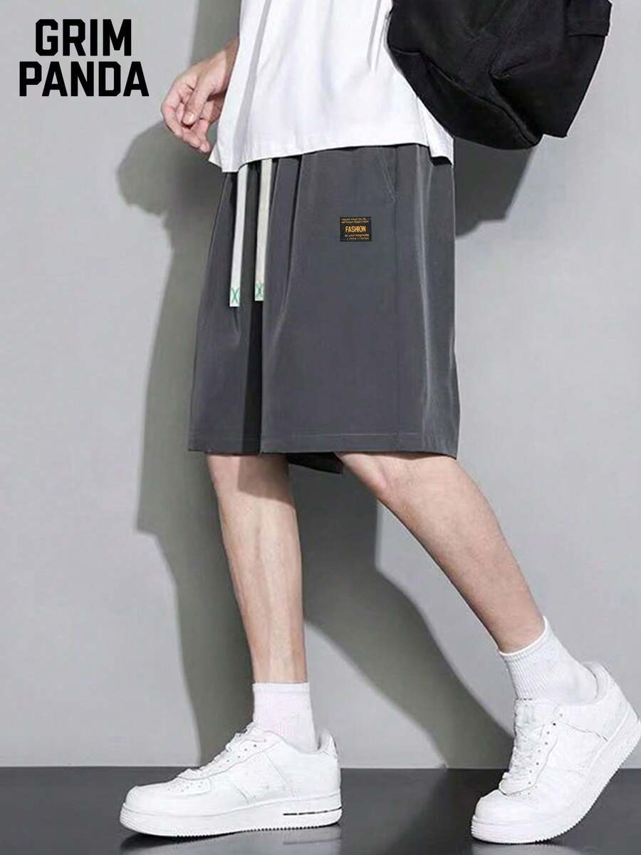 GRIM PANDA Pantalones cortos deportivos de fitness para hombre de secado rápido y ligeros de 5 pulgadas con bolsillos con cremallera para correr, uso casual diario de verano, entrenamiento al aire libre y ropa de gimnasio - Gris Oscuro - Ver 1