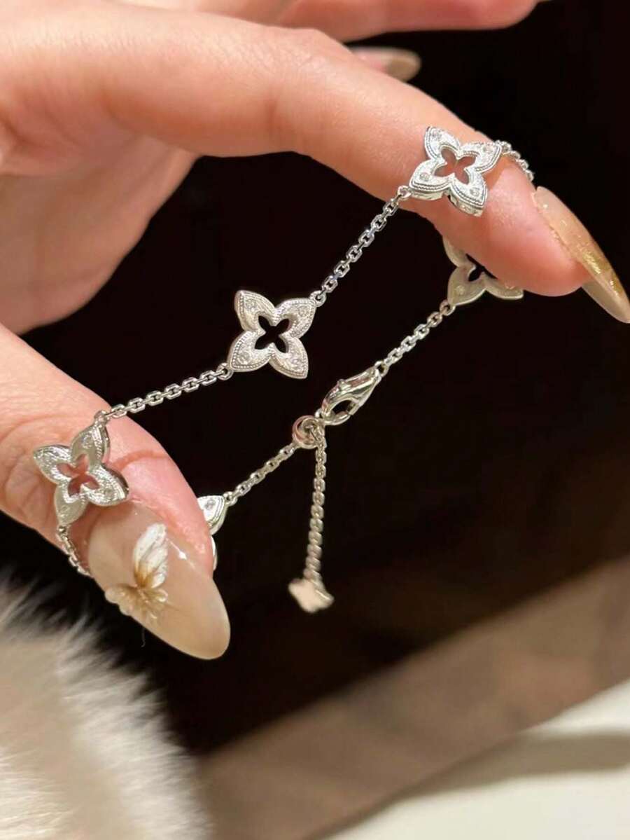 1pc New Hollow Four-Leaf Clover Bracelet For Women, Brushed Rhinestone Vintage French Style Plated Four-Leaf Flower Hand Jewelry With Tassel - Silver 1 - View 1