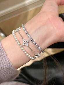 1pc New Hollow Four-Leaf Clover Bracelet For Women, Brushed Rhinestone Vintage French Style Plated Four-Leaf Flower Hand Jewelry With Tassel - Silver 1 - View 2