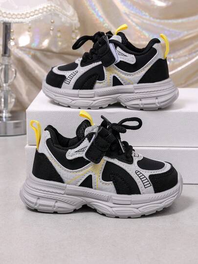 Giày thể thao trẻ em phối màu đen trắng mới, sneaker đế mềm dáng chunky unisex cho bé tập đi, giày đi bộ lưới thoáng khí, chống trượt, chống mài mòn, nhẹ, đa năng, phong cách thường ngày, chạy bộ hàng ngày, thiết kế phối đuôi vàng tương phản