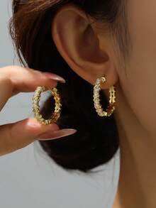 CHICAT Gold-Tone Synthetic Zirconia Knot Twisted Hoop Earrings For Women, Crystal X-Wrap Hinged Round Earrings, Vintage Glam Punk Statement Jewelry - Gold - View 2