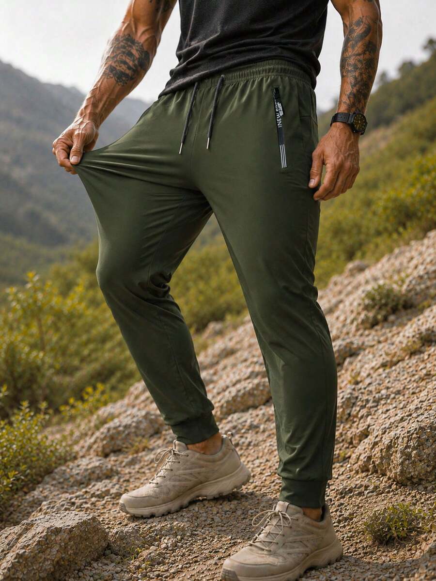 Men's Athletic Tapered Jogger Pants With Elastic Drawstring Waist, Medium Stretch Nylon Fabric, Side Zip Pockets, Cuffed Hem For Gym And Outdoor Wear - Army Green - View 1