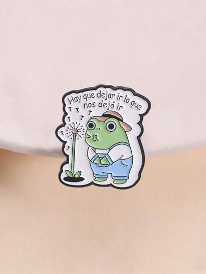 Dandelion Frog emaljbrosch med spansk healing-slogan "Let Go", metallnål, väskdekor och accessoar