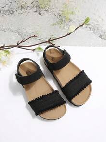 Sandalias planas para niños de color negro mate, tejidas, con una sola correa, cierre de gancho y bucle, suela blanda de corcho y punta abierta - Negro - Ver 2