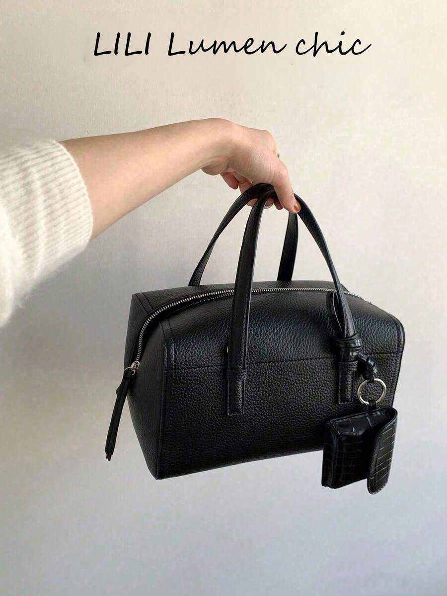 Fashionable Minimalist Black Lychee Grain Leather With Compact Structural Design And Durable Leather Material. Secure Zipper And Comfortable Handle Make It An Ideal Choice For Workdays Or Weekend Outings, Combining Exquisite Style And Practicality. - Black - View 1