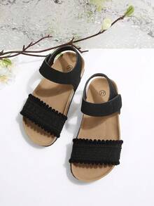 Sandalias planas para niños de color negro mate, tejidas, con una sola correa, cierre de gancho y bucle, suela blanda de corcho y punta abierta - Negro - Ver 1
