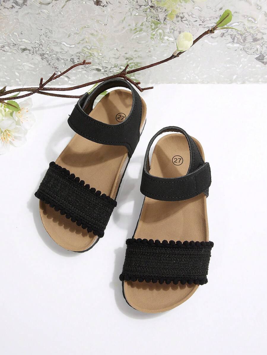 Sandalias planas para niños de color negro mate, tejidas, con una sola correa, cierre de gancho y bucle, suela blanda de corcho y punta abierta - Negro - Ver 1