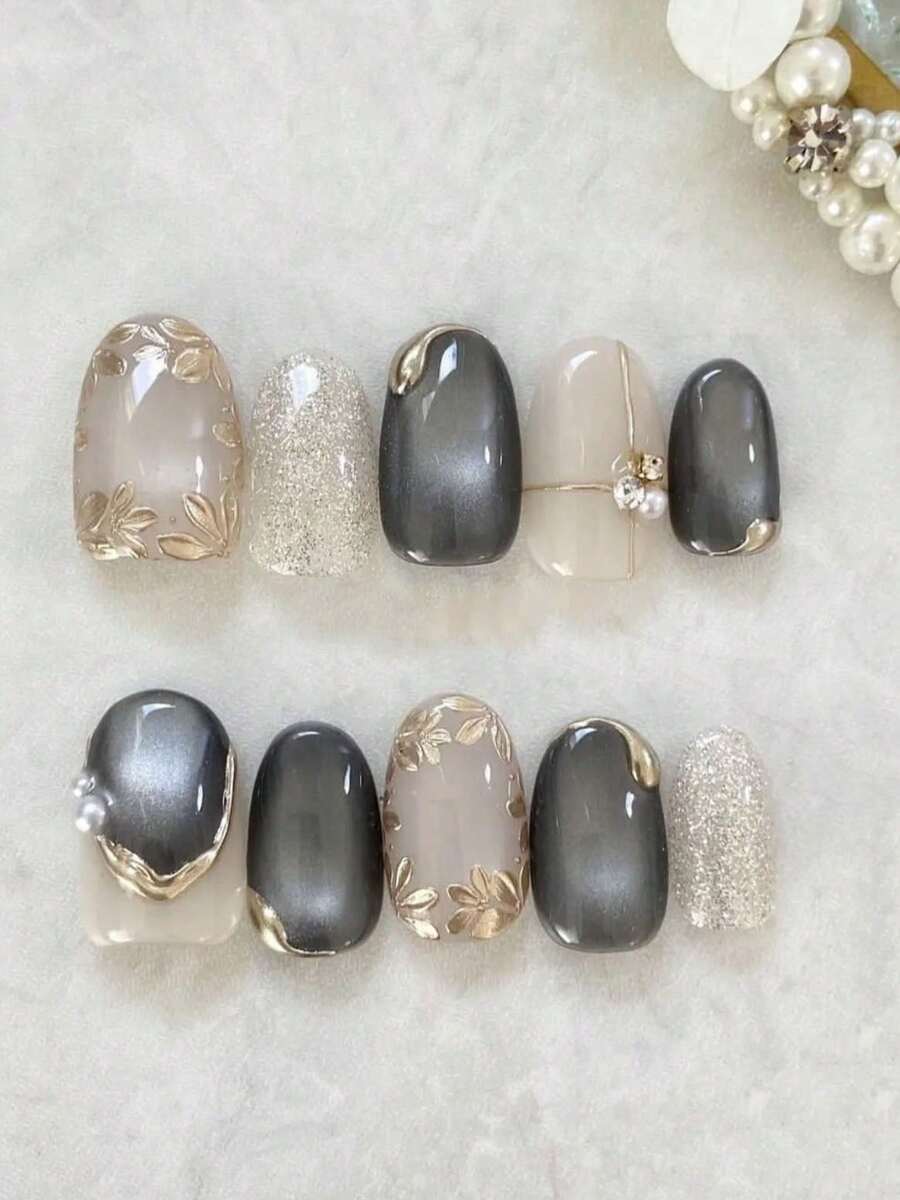 10片裝橢圓形手工穿戴式假指甲，奢華黑金貓眼亮面可重複使用，裸色金箔葉片、銀色亮粉、漸層黑貓眼、金線、珍珠與水鑽設計，適合女性日常、約會、晚餐與辦公室穿搭