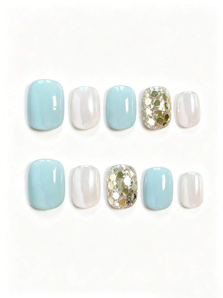 10 pièces Vernis à ongles bleu menthe œil de chat pailleté. Pièce d'art pour ongles courte et ronde, faite à la main, détachable, avec paillettes diamant et sequins blanc crème doux et aurore. Faux ongles de style court doux, simple, décontracté et professionnel, avec de grands sequins jaune-vert. Ongles à presser faits à la main - Multicolore - Voir 1