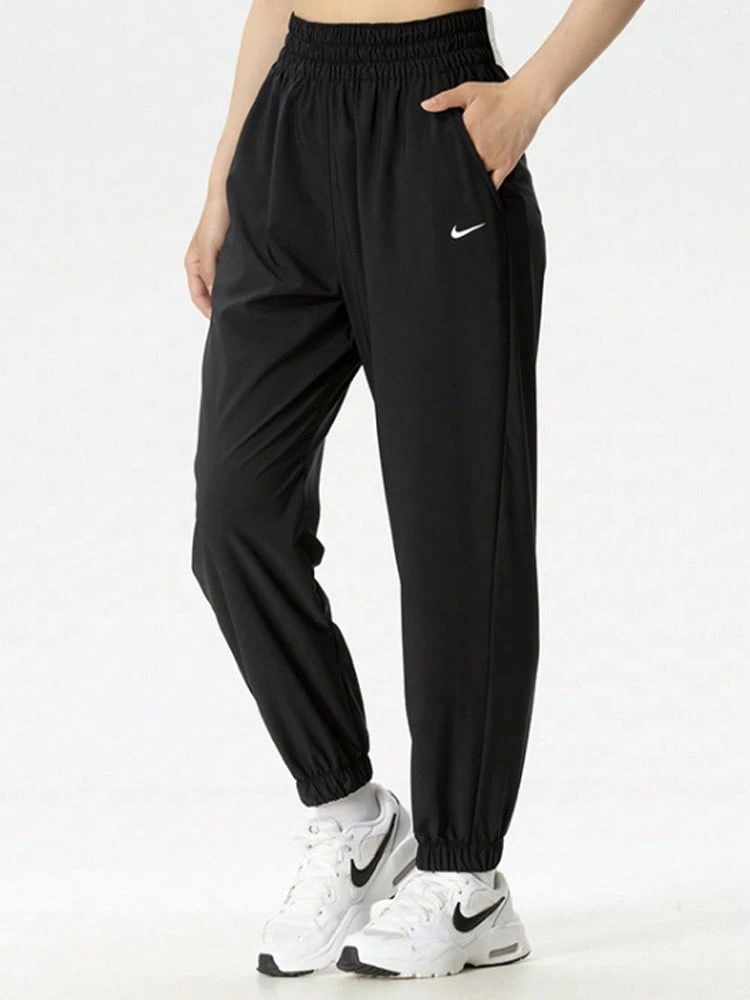 Nike Dri-Fit One Moisture-Wicking High-Waisted Athletic Casual Woven Pants (Women's) - Black - View 1
