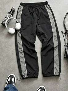 Pantalones jogger de hombre con textura arrugada de nailon, cintura con cordón, ajuste holgado, bloques de color laterales y detalles de costura, estilo casual de calle para uso diario - Gris - Ver 1