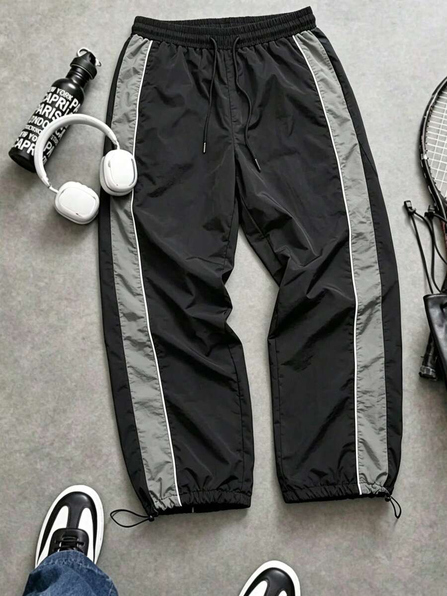 Pantalones jogger de hombre con textura arrugada de nailon, cintura con cordón, ajuste holgado, bloques de color laterales y detalles de costura, estilo casual de calle para uso diario - Gris - Ver 1