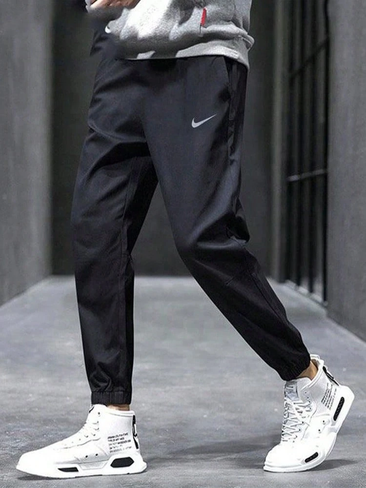 Nike Challenger Elastic Logo Soft Loose Comfort Mid-Rise Straight Leg Casual Pants For Men - Black - View 1