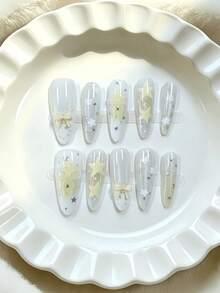 10pcs Almond-Shaped Medium Length Translucent Yellow Star Knot Nail Tips, Transparent Sweet Girl Style, Featuring 3D Bow Knot, Star And Tie Dye Patterns, Using Nude Translucent Color And 3D Decorative Craft, Suitable For Young Girls And Women, Fit For Daily Commute, Campus And Fresh Dating Occasions, Comes With Jelly Gel And Nail File Handmade Press On Nails - Yellow - View 1
