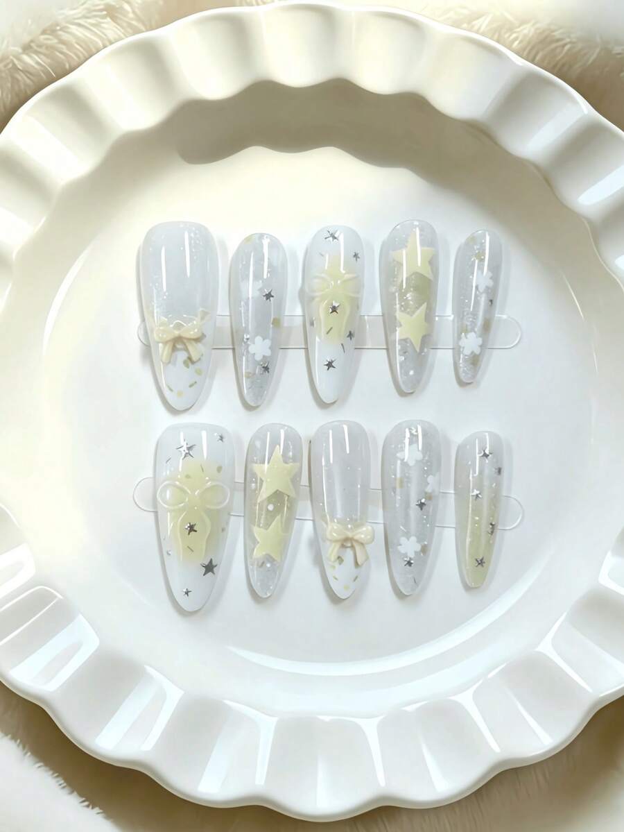 10pcs Almond-Shaped Medium Length Translucent Yellow Star Knot Nail Tips, Transparent Sweet Girl Style, Featuring 3D Bow Knot, Star And Tie Dye Patterns, Using Nude Translucent Color And 3D Decorative Craft, Suitable For Young Girls And Women, Fit For Daily Commute, Campus And Fresh Dating Occasions, Comes With Jelly Gel And Nail File Handmade Press On Nails - Yellow - View 1