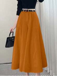 High-Waisted Solid-Colored Skirt With Pockets On Both Sides And A Wide Hem. - Rust Brown - View 1
