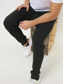 Calça de moletom preta básica casual masculina, com bolsos com zíper e cordão, em tecido levemente elástico. - Preto - Visão 6